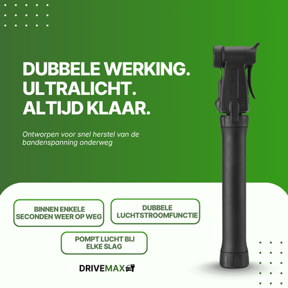 Zwarte pompka rowerowa DriveMax widziana z przodu na zielonym tle promocyjnym.